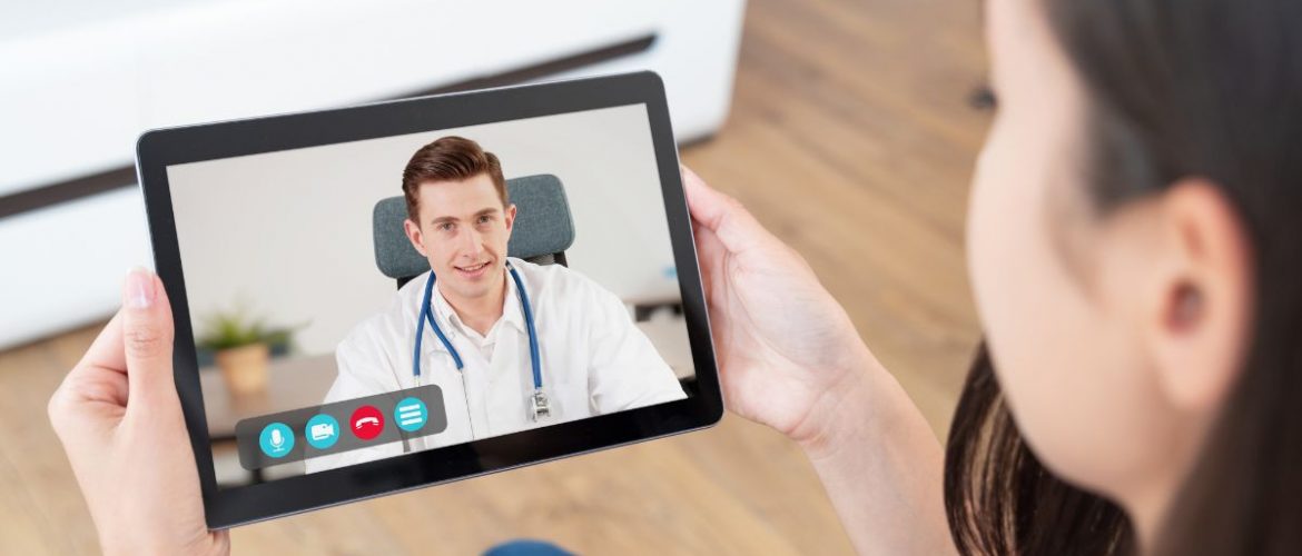Patient consulting with doctor on tablet