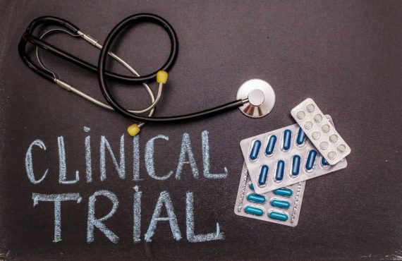Clinical trial sign with stethoscope and medications