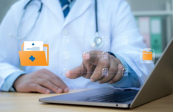 A medical worker works with an electronic database of patient access