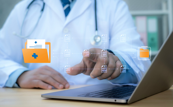 A medical worker works with an electronic database of patient access