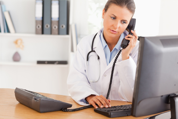 Doctor on call with her patient in her office