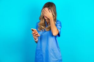 doctor checking phone for missed calls